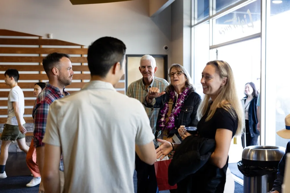 Church members talking together in the Lighthouse lobby