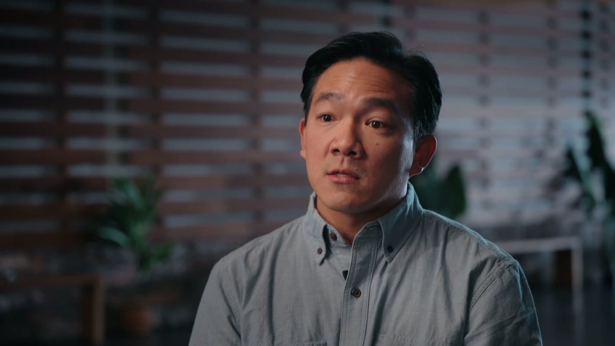 Brian Chang seated in the Lighthouse lobby, telling his story